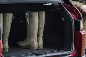 Wellies in a Land Rover